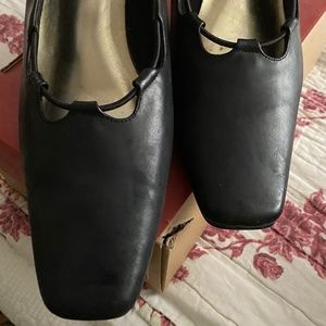 Black leather pumps
